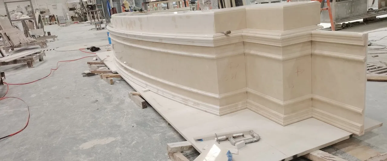 Large custom shaped stone pieces arranged in a workshop